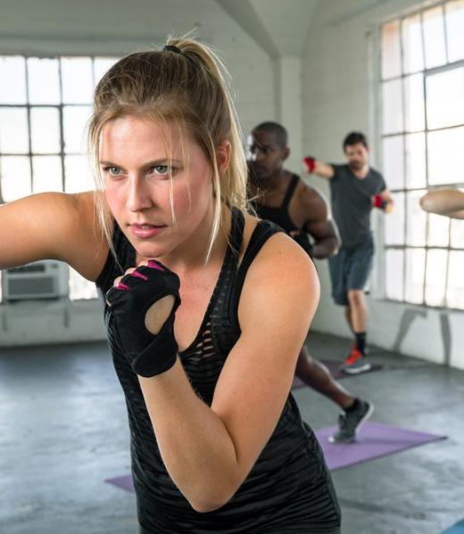 Female,Punching,In,Aerobics,Fitness,High,Intense,Fitness,Class,Coed